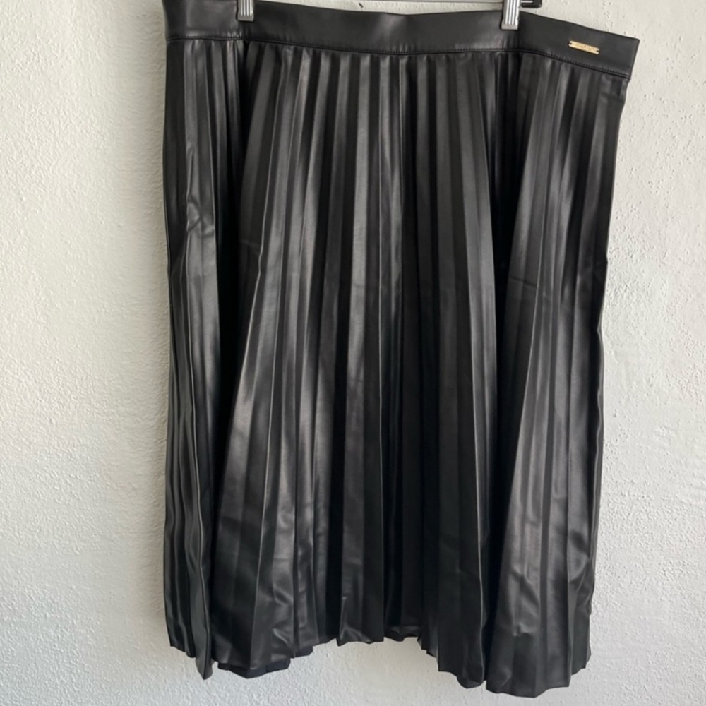 Knee length black leather skirt